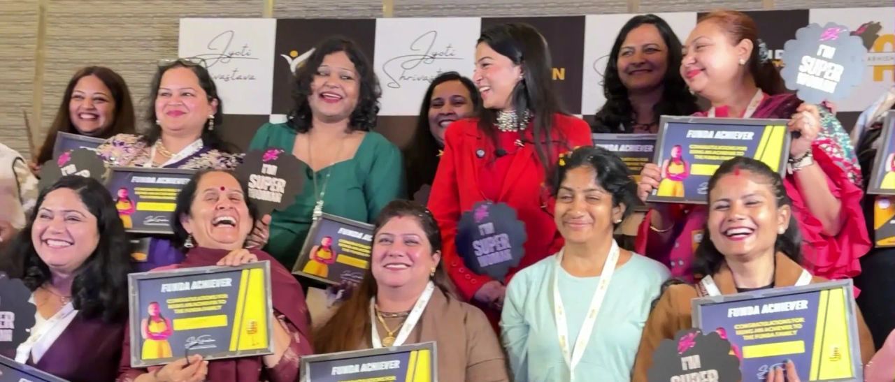 Smiling Superwomen holding FunDa Achiever certificates with Dr. Jyoti