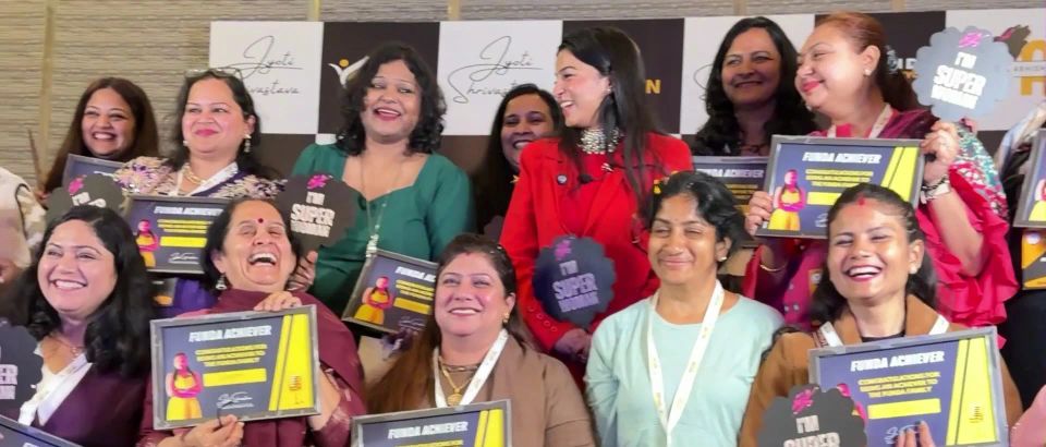 Smiling Superwomen holding FunDa Achiever certificates with Dr. Jyoti