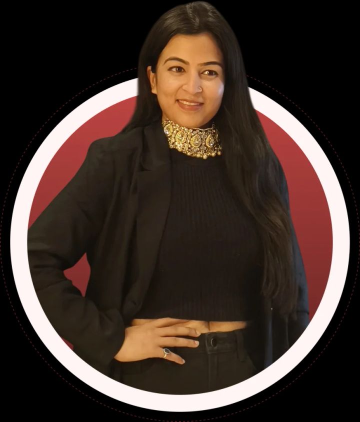 Dr. Jyoti Srivastava in a black blazer, smiling with hands on hips
