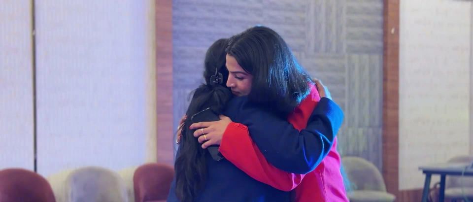 Dr. Jyoti in a warm embrace with a member