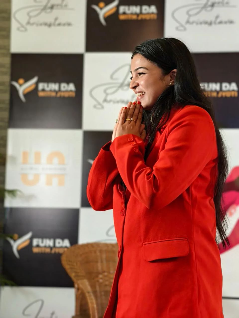 Dr. Jyoti greeting members with a namaste at a FunDa event