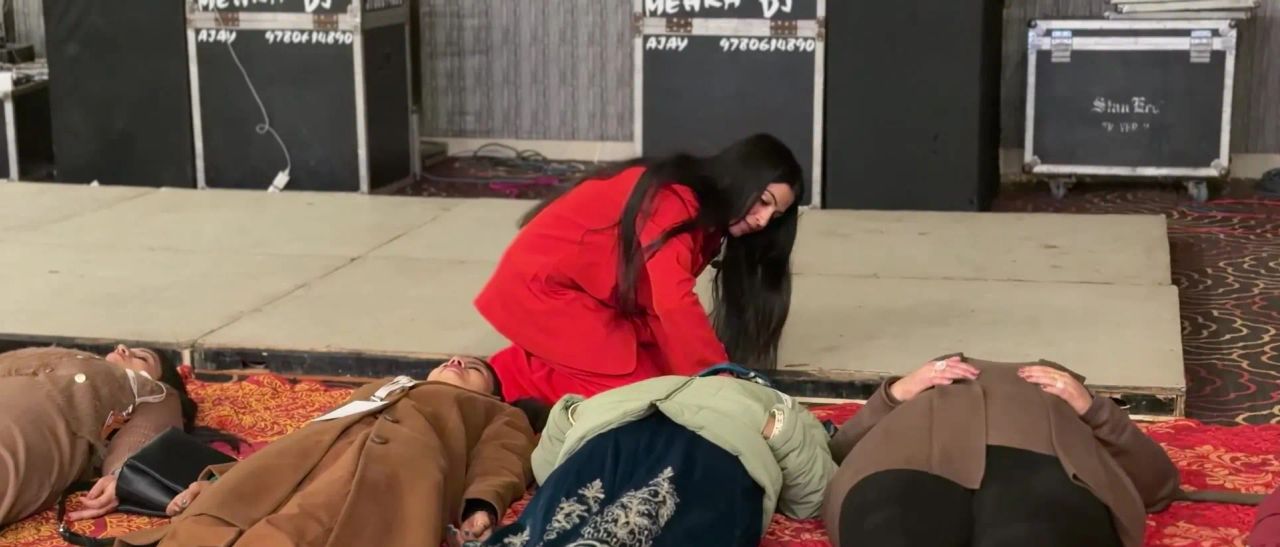 Dr. Jyoti guiding women lying down in a relaxation session